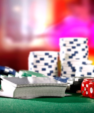 Dice, cards and chips on a table