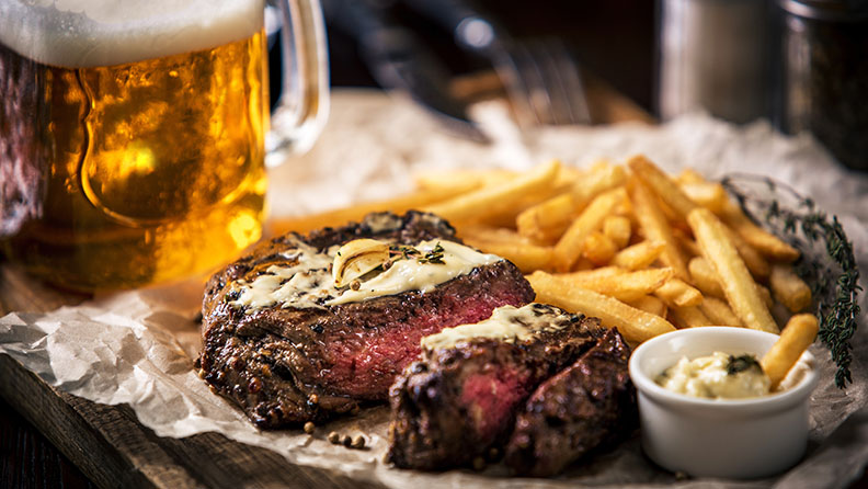 image of beer with steak and french fries
